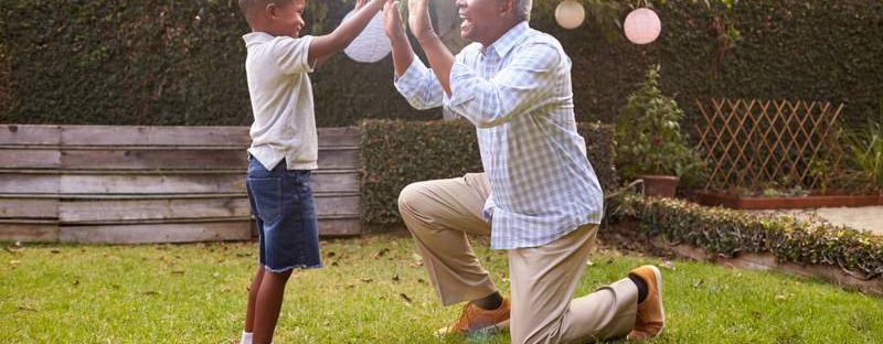 Grandfather and grandson high fiving