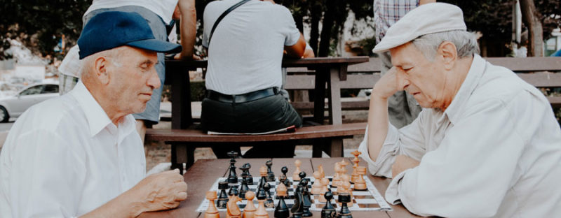 Two retired men playing chess